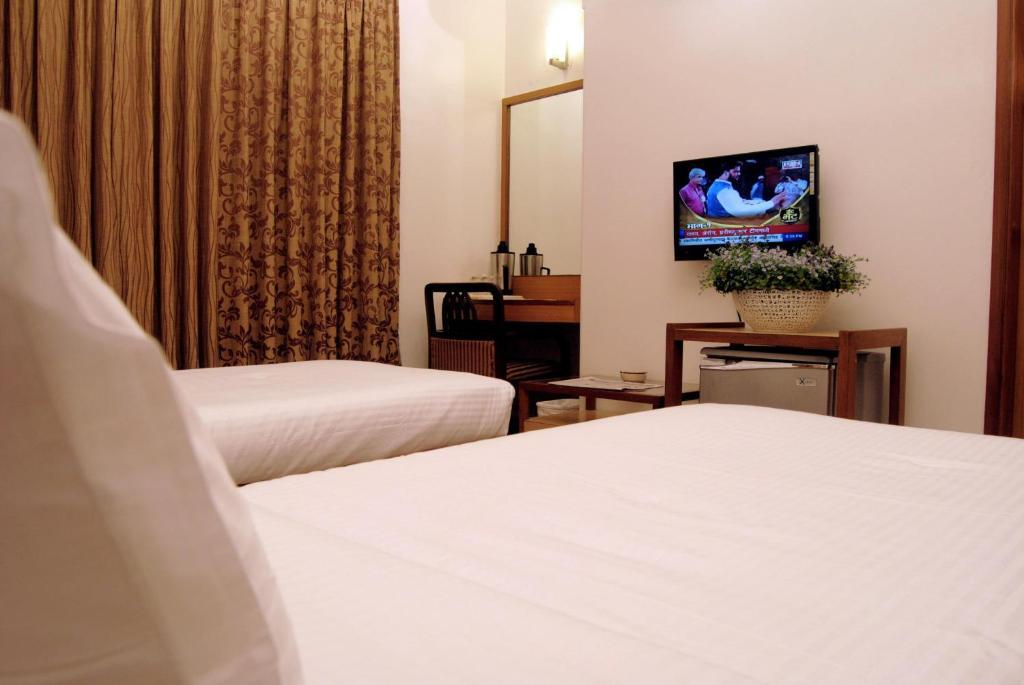 The Ambience Hotel Púna Pokoj fotografie