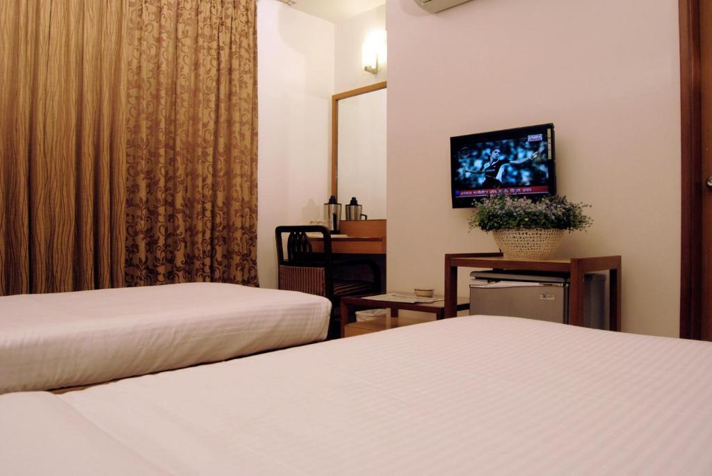 The Ambience Hotel Púna Pokoj fotografie