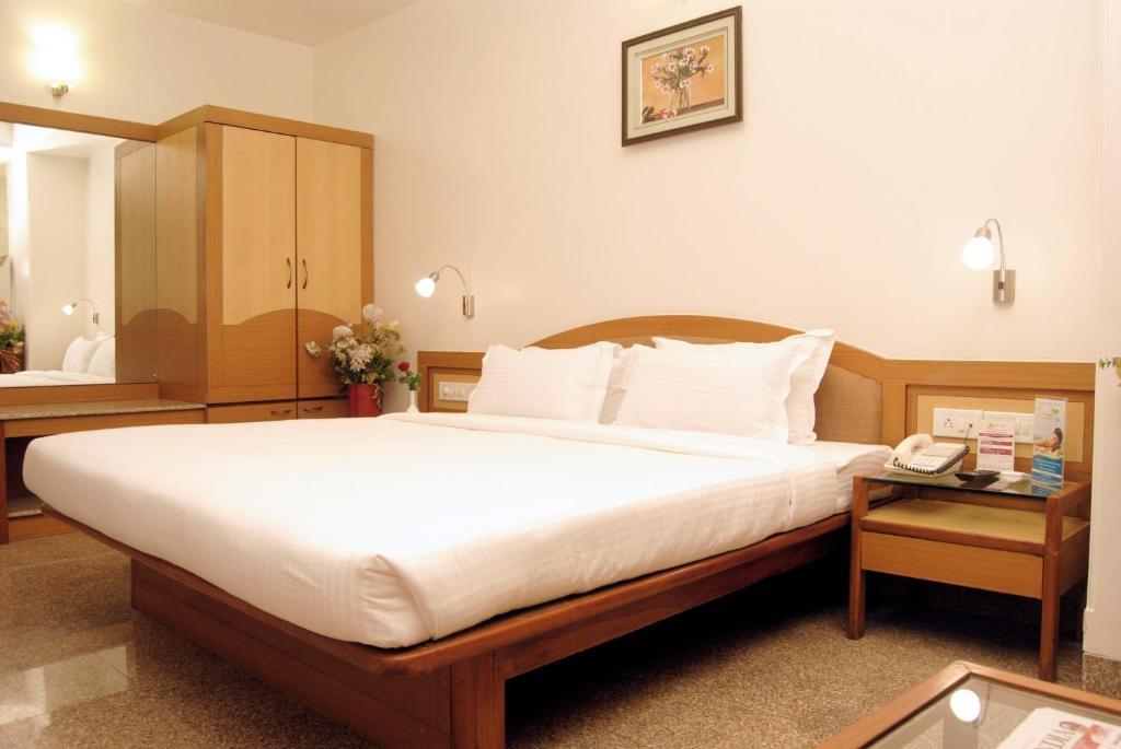 The Ambience Hotel Púna Pokoj fotografie