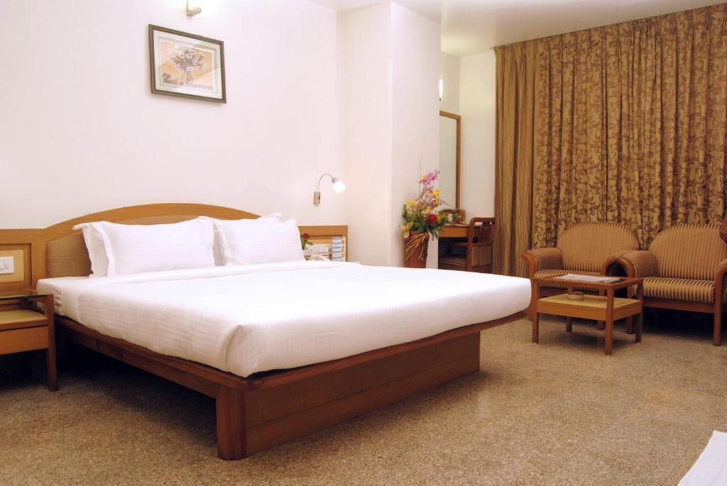 The Ambience Hotel Púna Pokoj fotografie